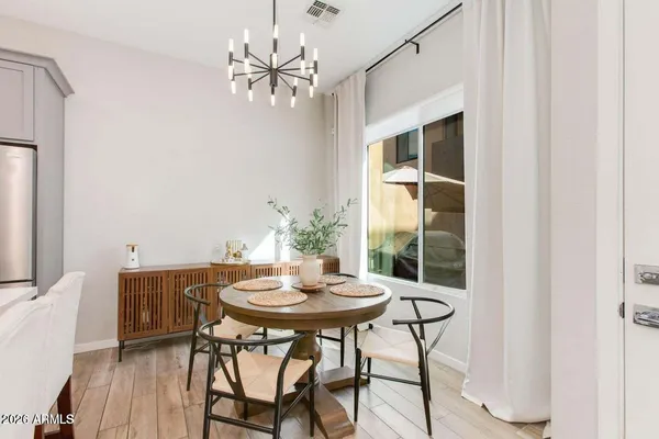 a view of a dining room with furniture and wooden floor