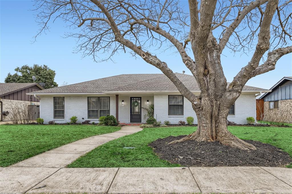 2110 Drake Drive Richardson, TX 75081 - Photo 1 of 1 a front view of a house with garden