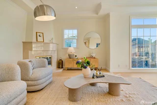 a living room with furniture and a table