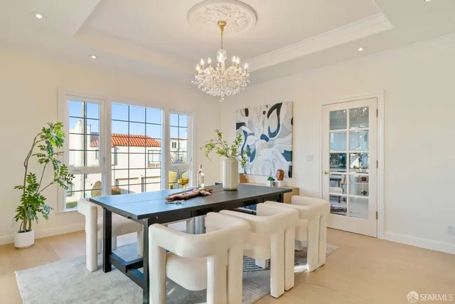 a room with table and potted plants