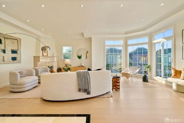 a kitchen with granite countertop white cabinets and appliances