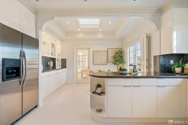 a bedroom with a bed chair and a window