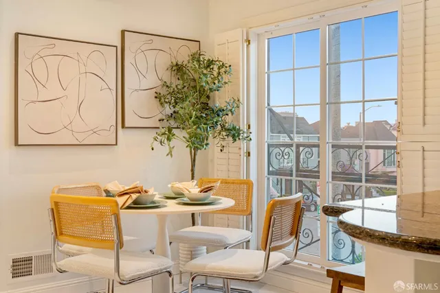 a bathroom with a granite countertop toilet sink and mirror