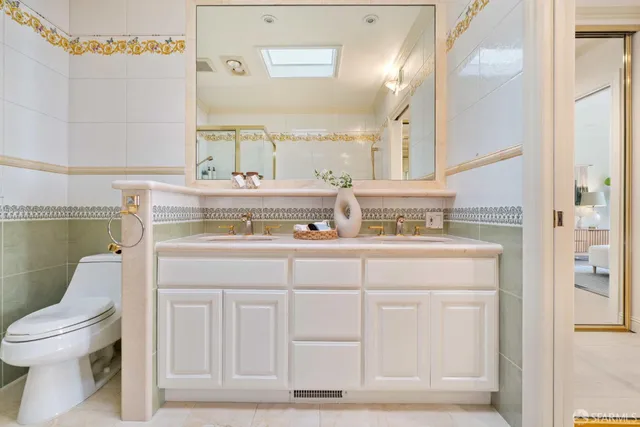 a bedroom with bed and a potted plant