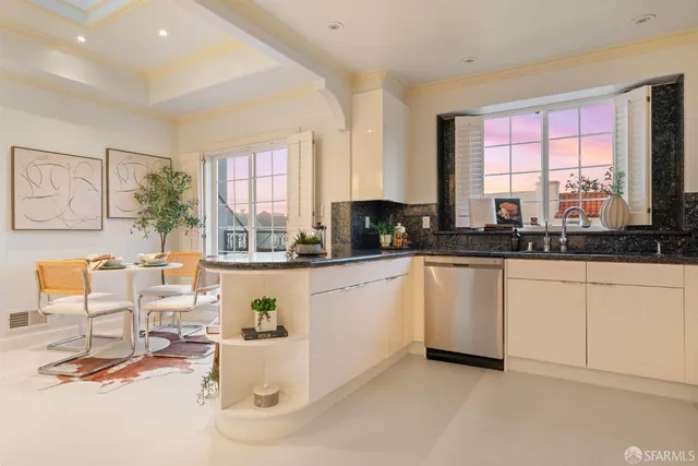 a view of a chair and tables in the backyard