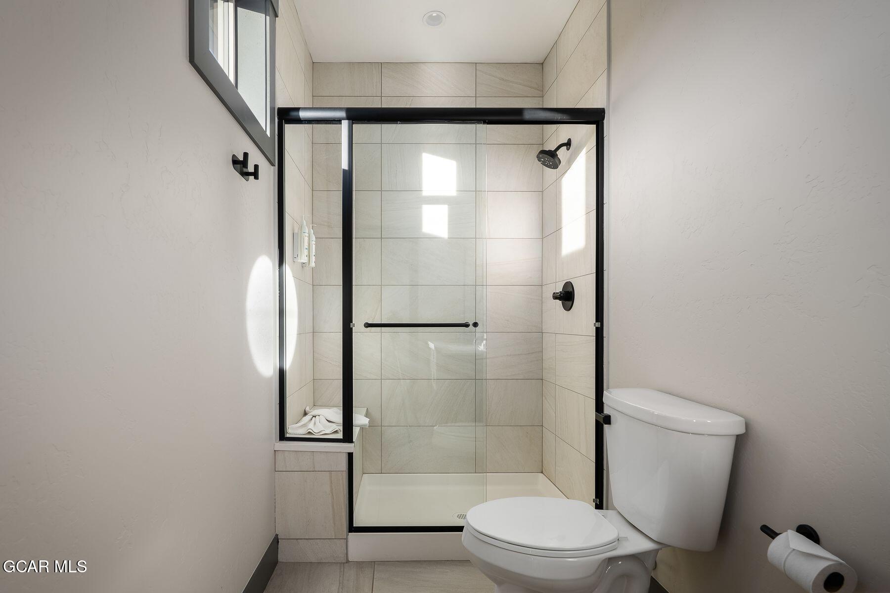 102 Eagle Ridge Drive Granby, CO 80446 - Photo 18 of 44 a bathroom with a shower a toilet and a sink