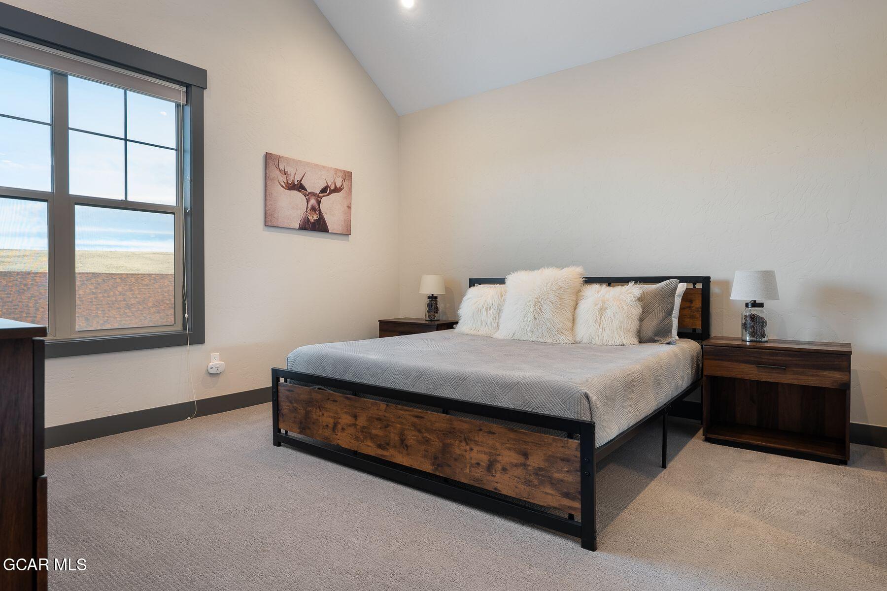 102 Eagle Ridge Drive Granby, CO 80446 - Photo 20 of 44 a bedroom with a bed and window