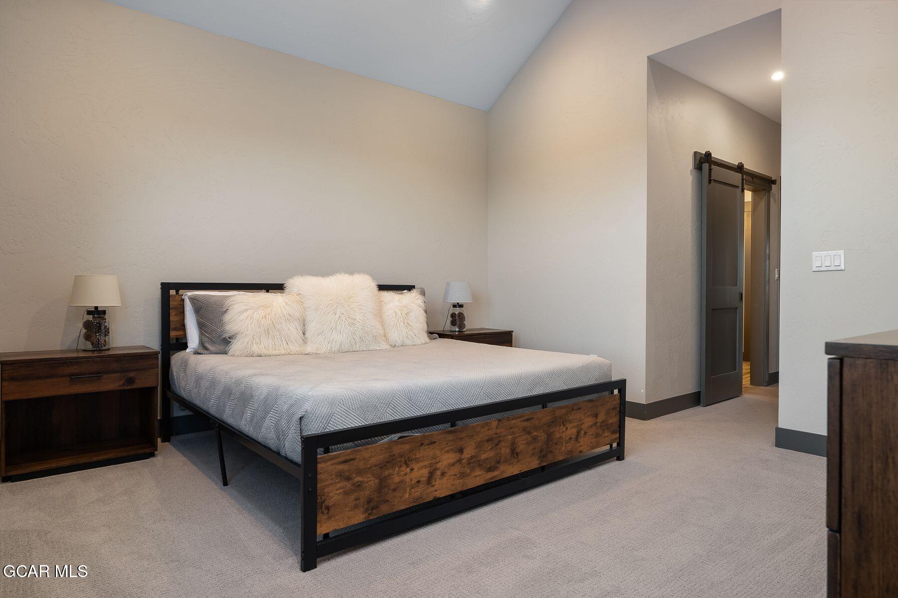 102 Eagle Ridge Drive Granby, CO 80446 - Photo 21 of 44 a bedroom with a bed and a night stand