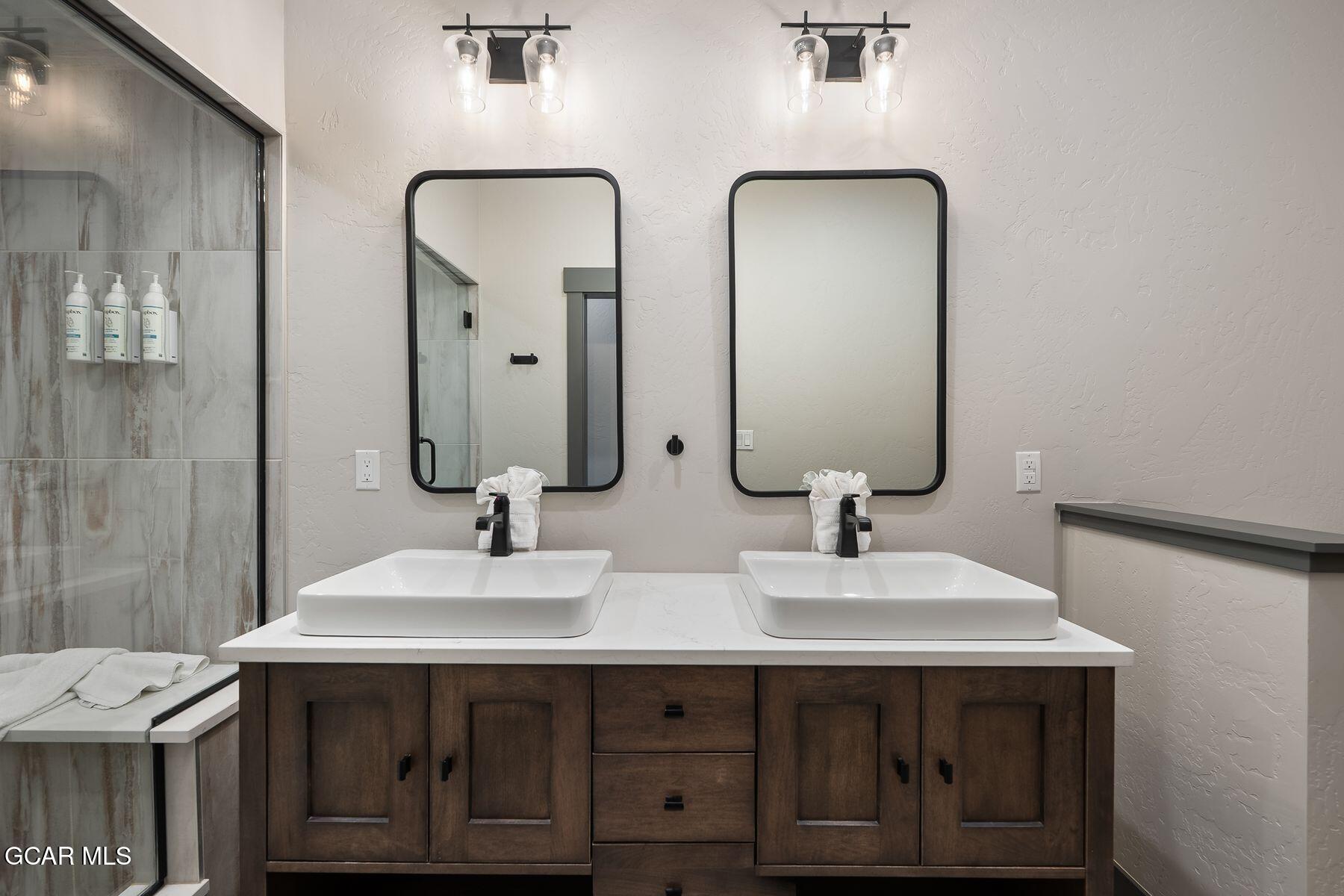 102 Eagle Ridge Drive Granby, CO 80446 - Photo 22 of 44 a bathroom with double sink and two mirror
