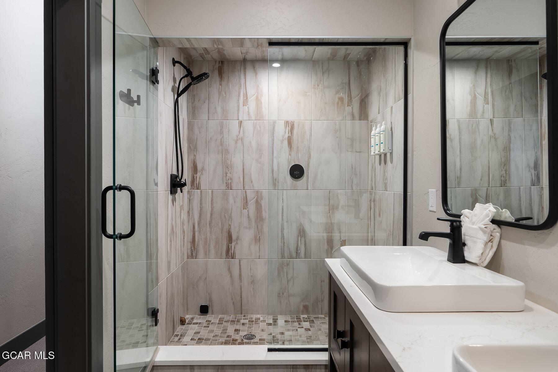 102 Eagle Ridge Drive Granby, CO 80446 - Photo 23 of 44 a bathroom with a sink and a mirror