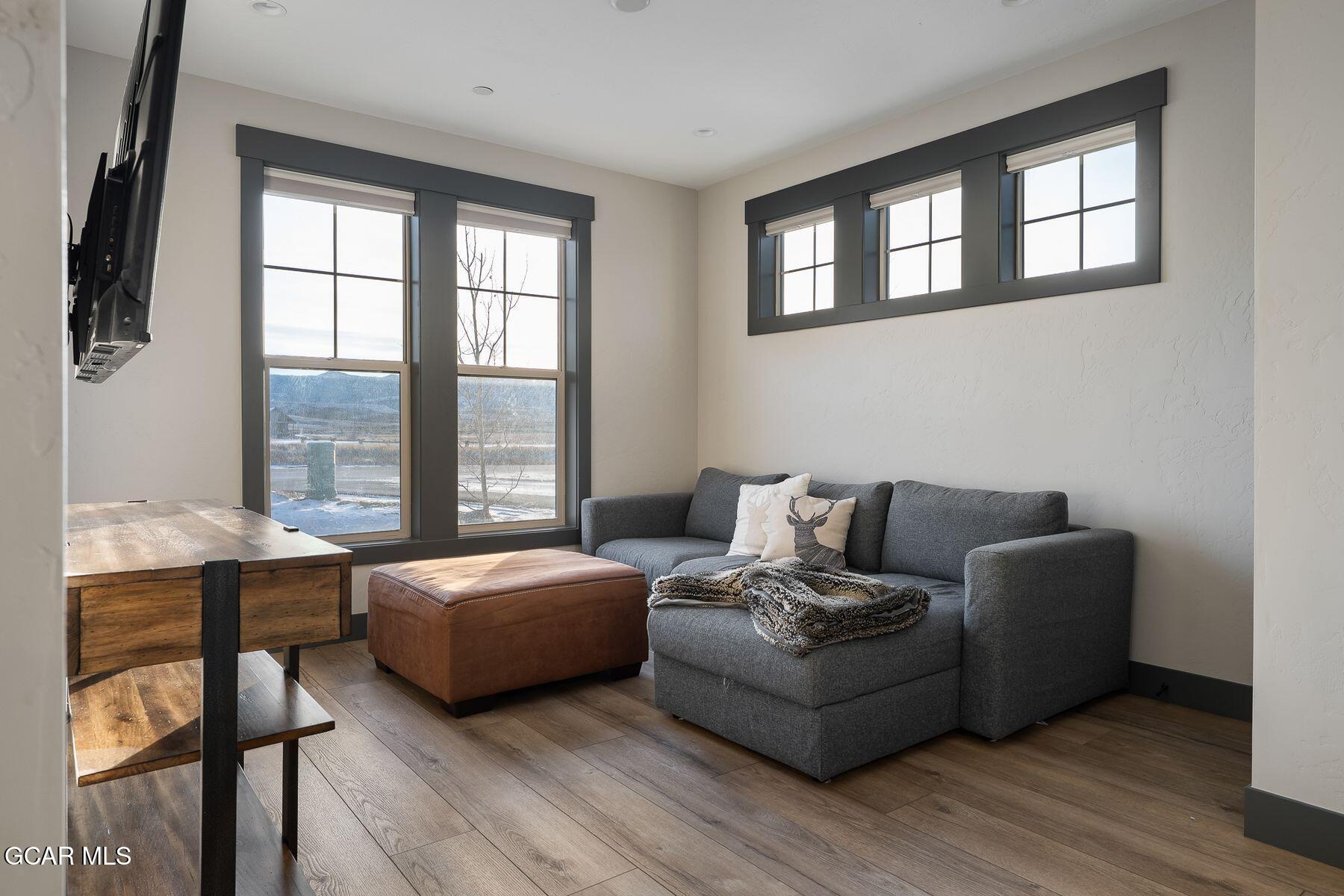 102 Eagle Ridge Drive Granby, CO 80446 - Photo 24 of 44 a living room with furniture and a large window