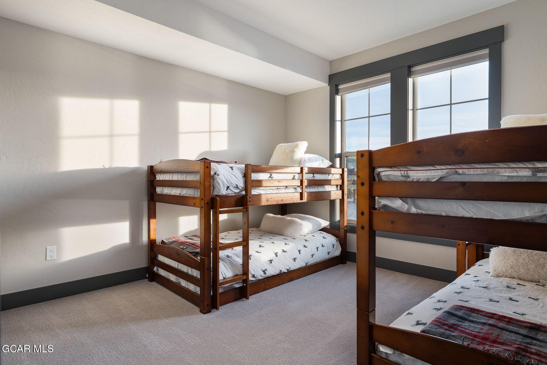 102 Eagle Ridge Drive Granby, CO 80446 - Photo 25 of 44 a bedroom with a bed and window