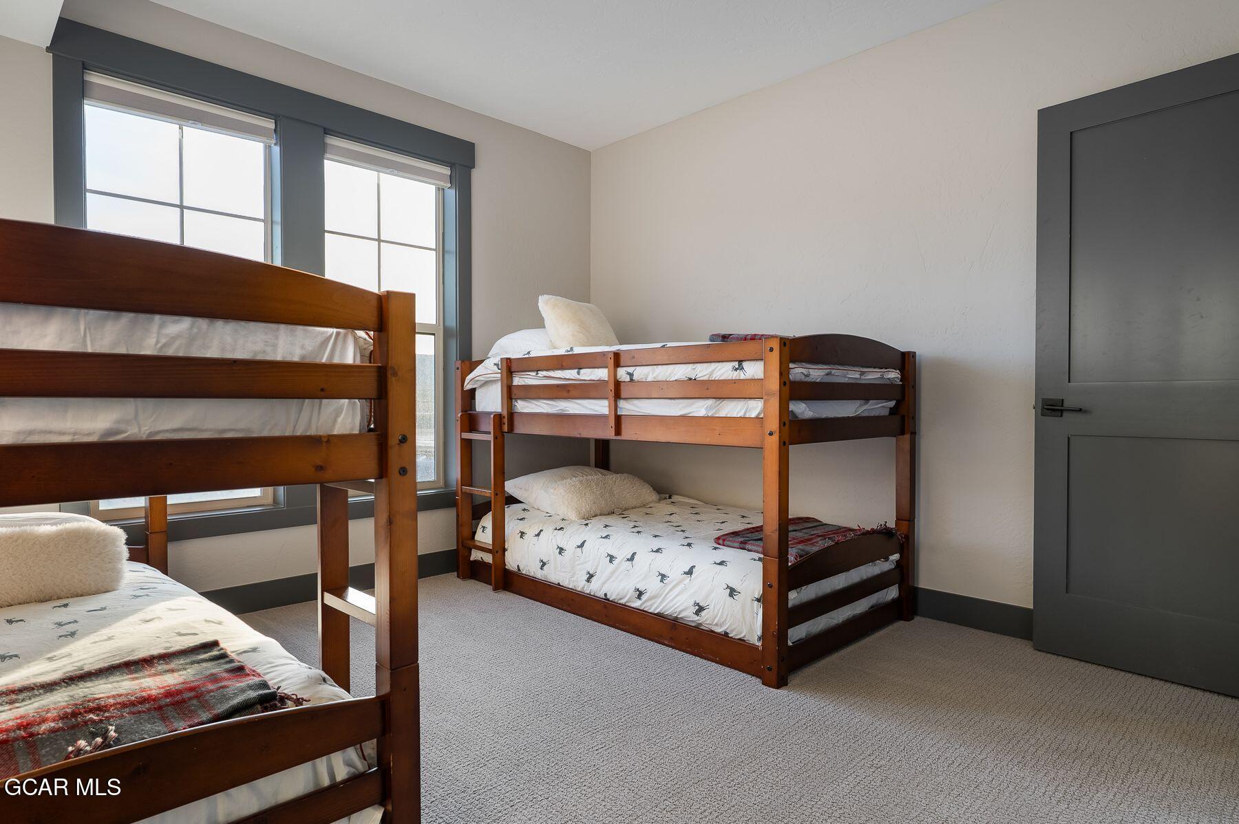 102 Eagle Ridge Drive Granby, CO 80446 - Photo 26 of 44 a bedroom with a bed and a window
