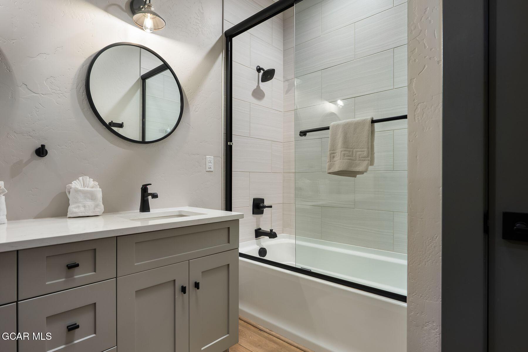 102 Eagle Ridge Drive Granby, CO 80446 - Photo 31 of 44 a bathroom with a mirror a sink and a mirror