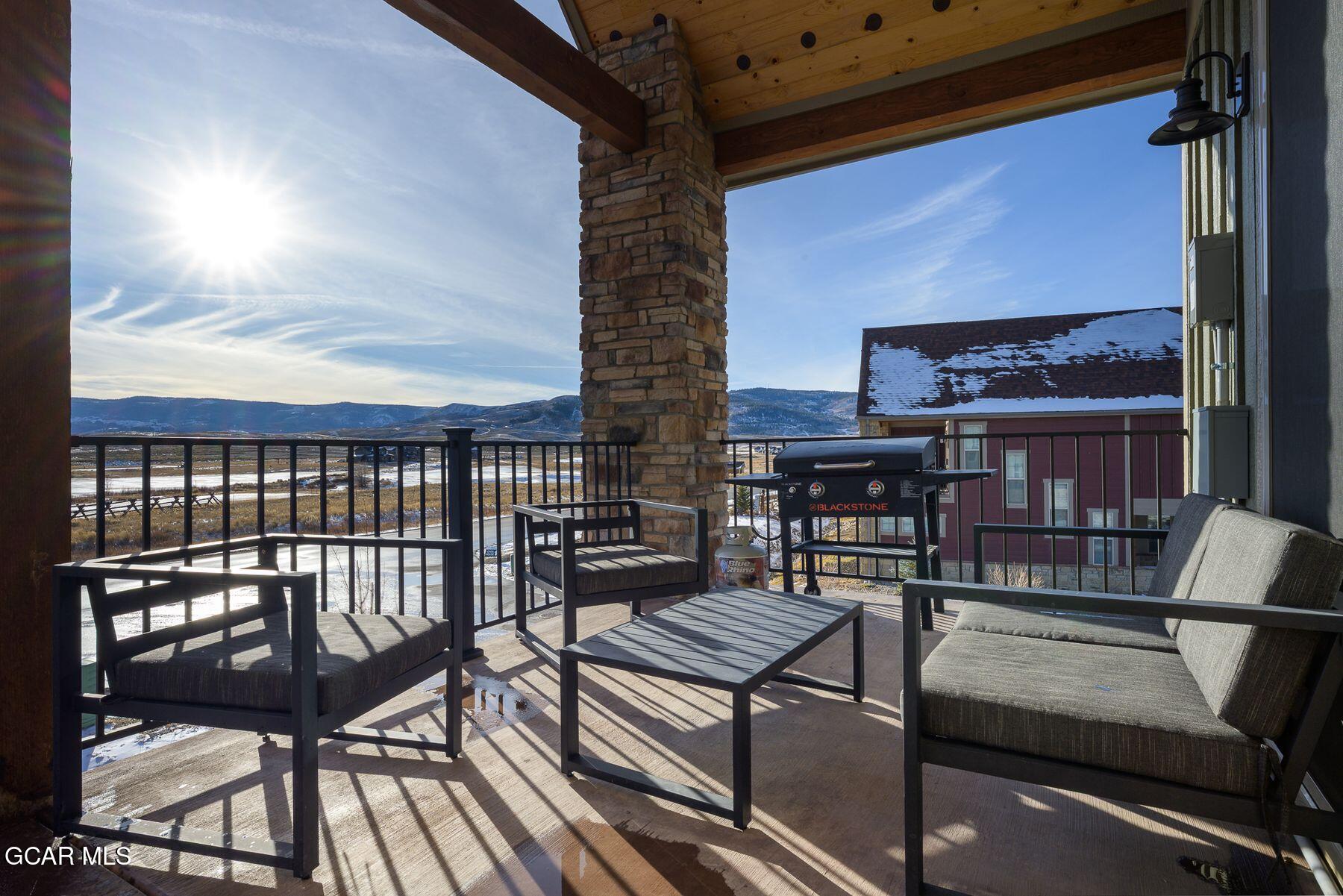 102 Eagle Ridge Drive Granby, CO 80446 - Photo 33 of 44 a roof deck with a table and chairs