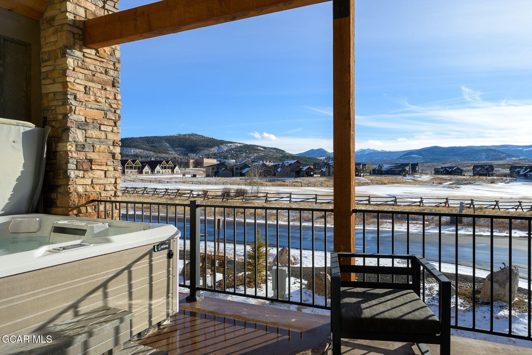 102 Eagle Ridge Drive Granby, CO 80446 - Photo 4 of 44 a view of a balcony with wooden floor and iron stairs