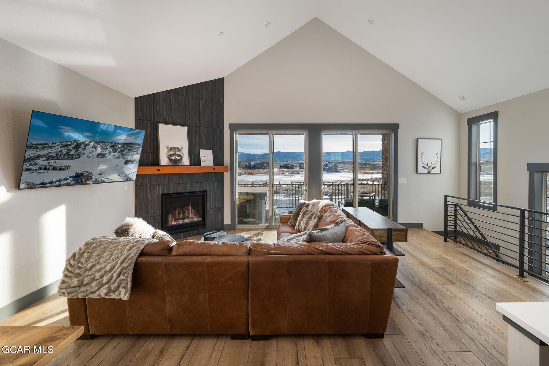 102 Eagle Ridge Drive Granby, CO 80446 - Photo 6 of 44 a living room with furniture window and a fireplace