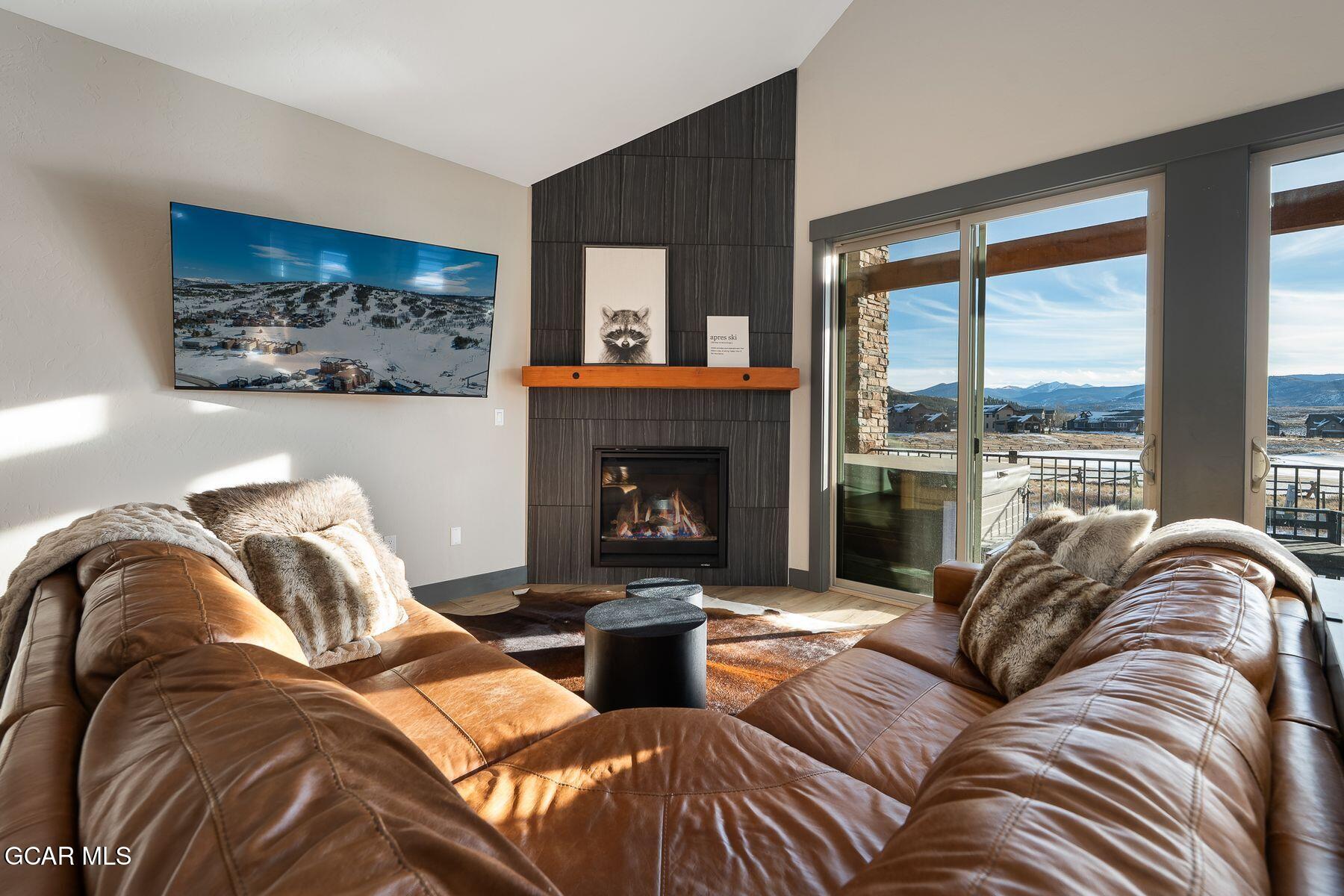 102 Eagle Ridge Drive Granby, CO 80446 - Photo 10 of 44 a living room with furniture and a fireplace
