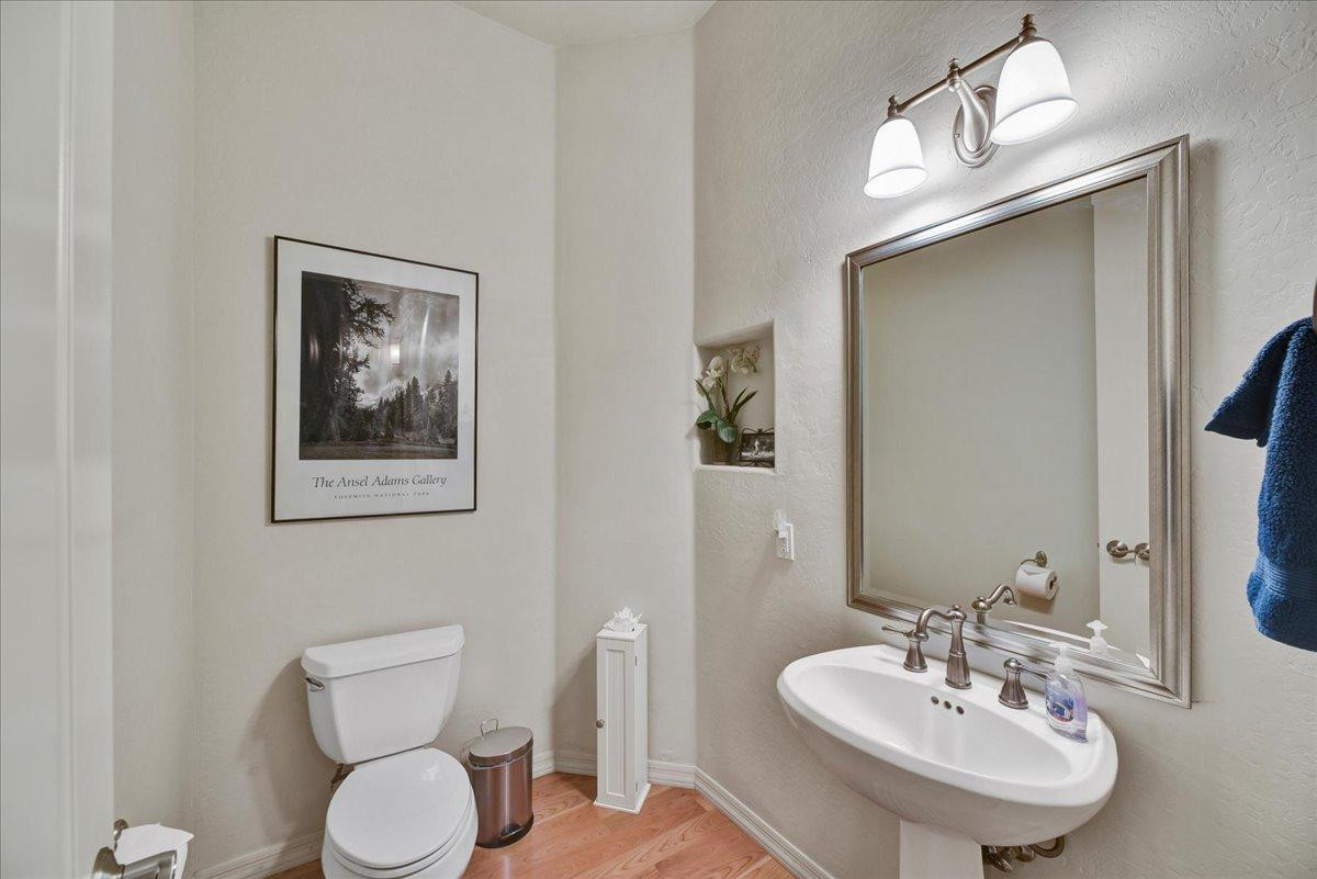 412 East Yearling Road Phoenix, AZ 85085 - Photo 25 of 51 a bathroom with a toilet a sink and mirror