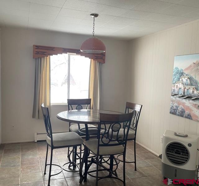 16424 Bull Mesa Road Cedaredge, CO 81413 - Photo 11 of 11 a dining room with furniture and window