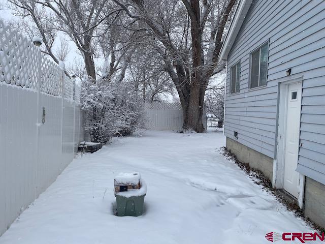 16424 Bull Mesa Road Cedaredge, CO 81413 - Photo 2 of 11 a view of a house with a snow