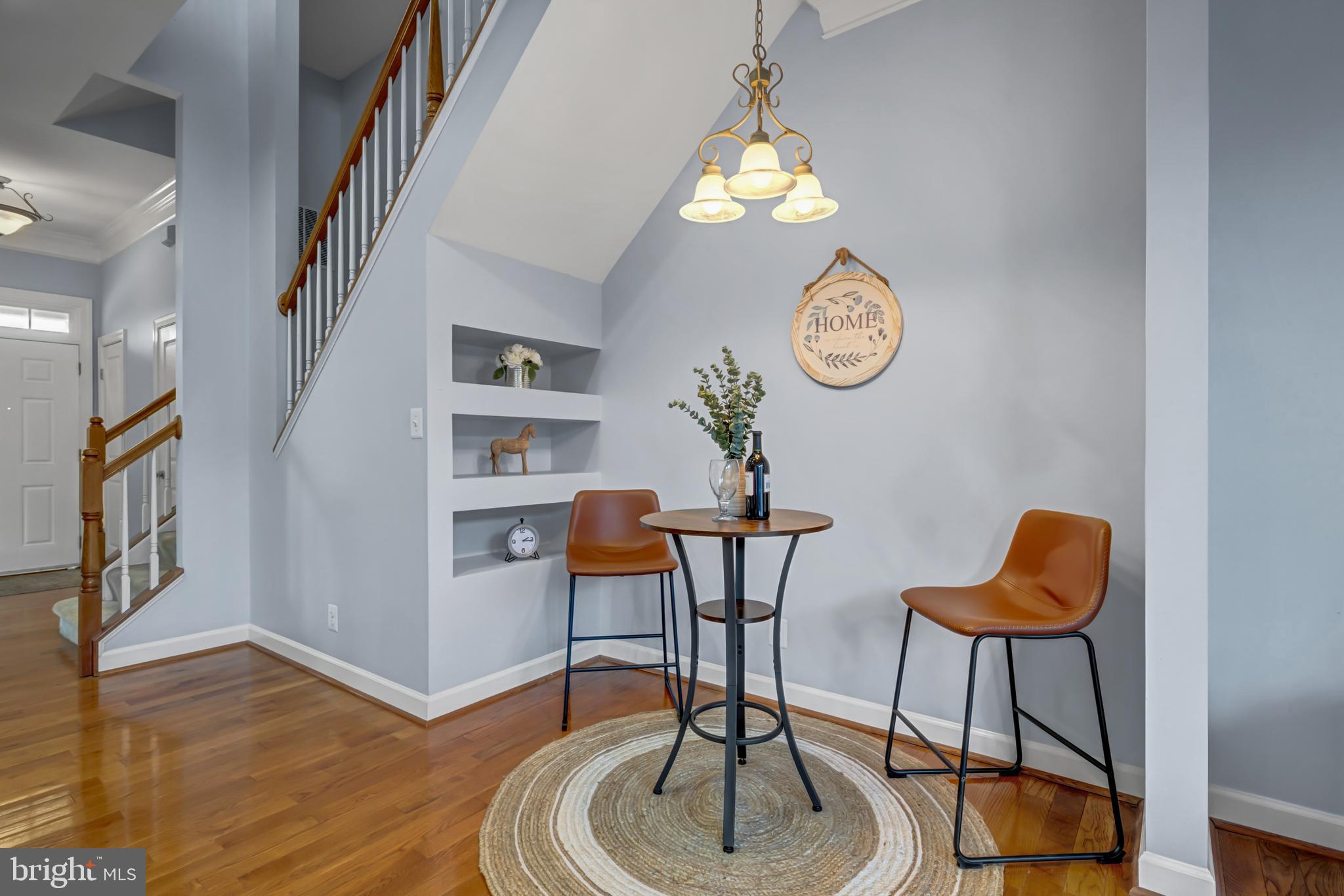 9231 Ribbon Falls Loop Bristow, VA 20136 - Photo 10 of 40 a view of a livingroom with furniture wooden floor and a clock