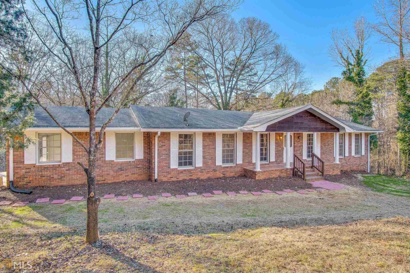 826 Jim Starr Road Newnan, GA 30263 - Photo 1 of 1 a front view of a house with a yard