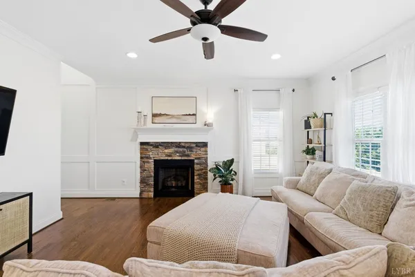 a kitchen with granite countertop white cabinets and stainless steel appliances