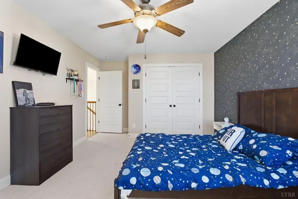 an aerial view of residential houses with city view