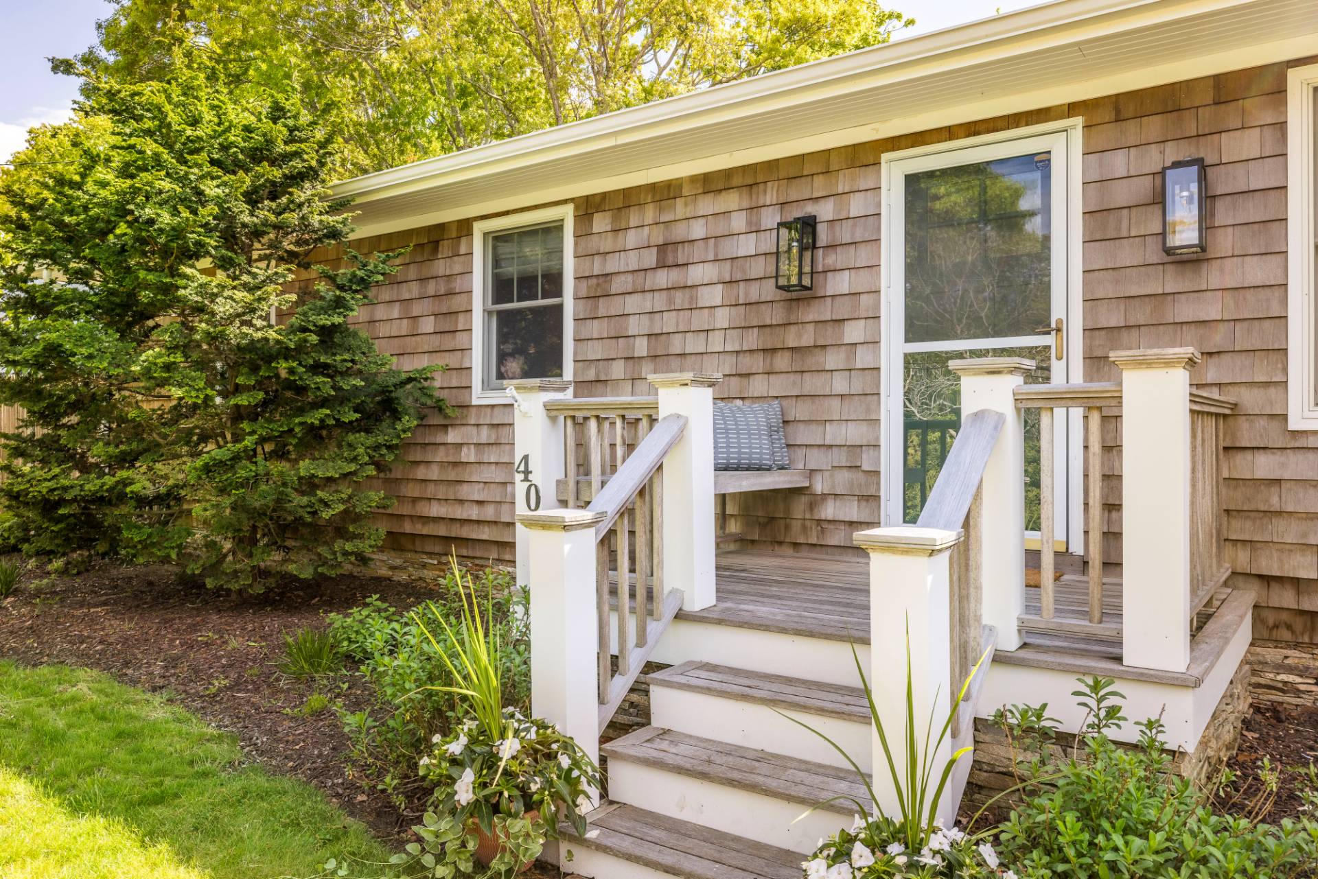 40 Ridge Road West Sag Harbor, NY 11963 - Photo 19 of 27 a front view of a house with a garden
