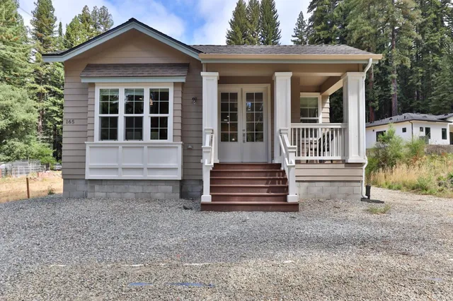 front view of a house with a yard