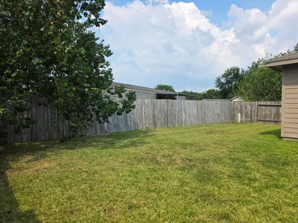 a view of a back yard of the house