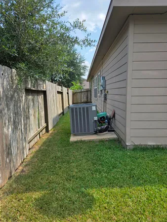 a living room with furniture and flowers