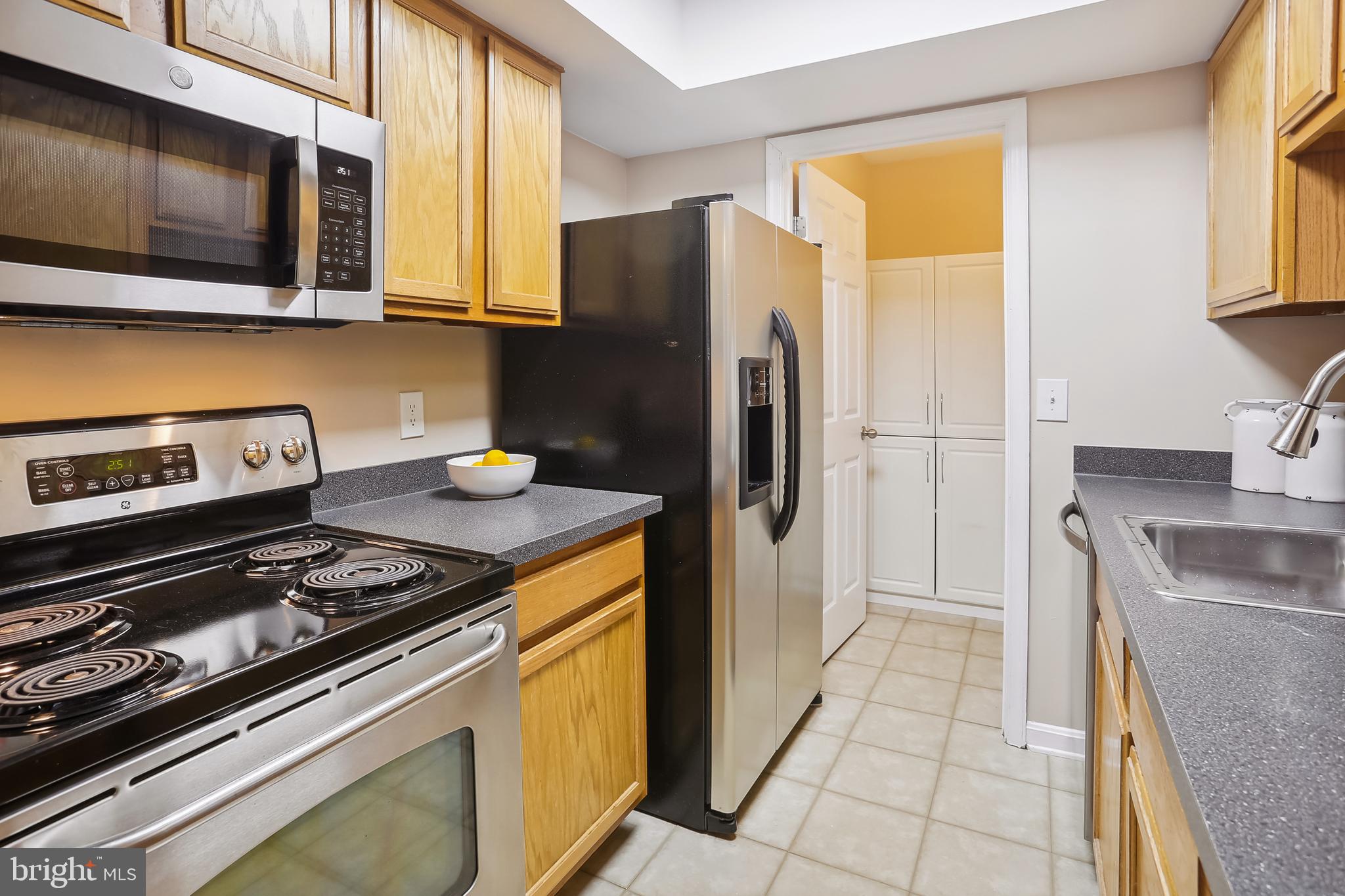 14800 Rydell Road, Unit 201 Centreville, VA 20121 - Photo 21 of 31 Stainless Steel Appliances in the Galley Kitchen