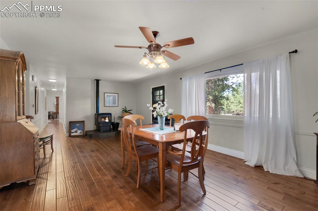 16635 High Tree Drive Elbert, CO 80106 - Photo 14 of 50 a view of a dining room with furniture window and wooden floor