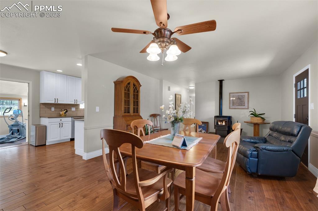 16635 High Tree Drive Elbert, CO 80106 - Photo 15 of 50 a view of a dining room with furniture and wooden floor