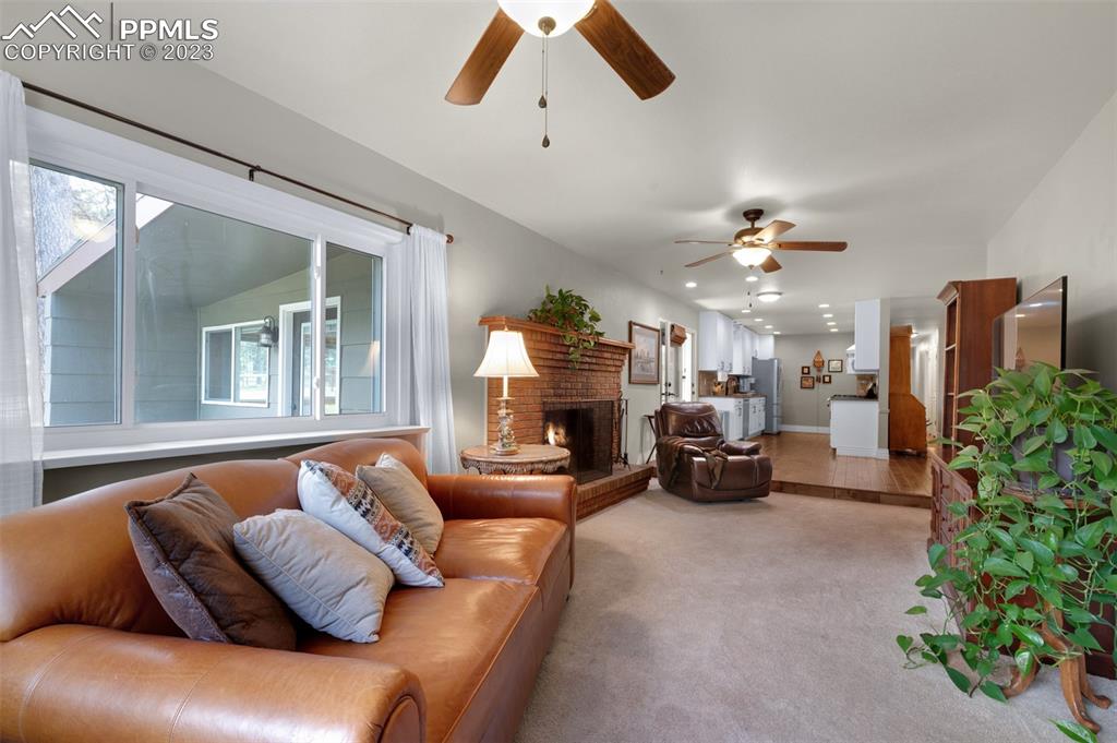 16635 High Tree Drive Elbert, CO 80106 - Photo 18 of 50 a bed room with furniture and a chandelier