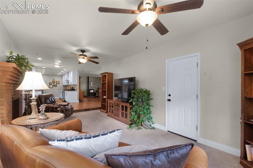 16635 High Tree Drive Elbert, CO 80106 - Photo 19 of 50 a living room with furniture kitchen chandelier and a wooden floor
