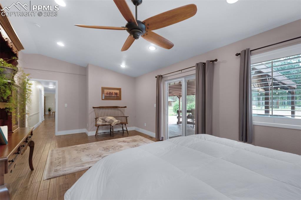 16635 High Tree Drive Elbert, CO 80106 - Photo 24 of 50 a bedroom with a bed and a large window with the outer view