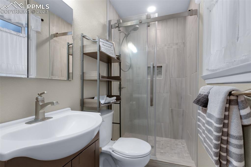 16635 High Tree Drive Elbert, CO 80106 - Photo 30 of 50 a bathroom with a sink toilet and shower