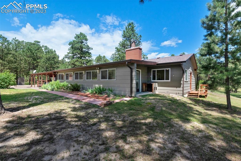 16635 High Tree Drive Elbert, CO 80106 - Photo 35 of 50 a view of a house with backyard and garden