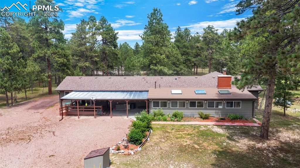 16635 High Tree Drive Elbert, CO 80106 - Photo 39 of 50 a front view of house with yard and trees in the background