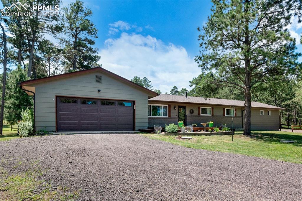 16635 High Tree Drive Elbert, CO 80106 - Photo 43 of 50 a front view of house with garage and yard