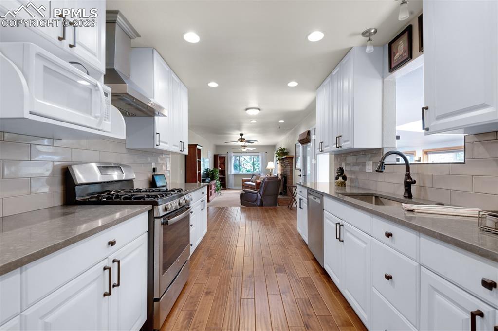 16635 High Tree Drive Elbert, CO 80106 - Photo 5 of 50 a large kitchen with stainless steel appliances lots of counter space and a sink