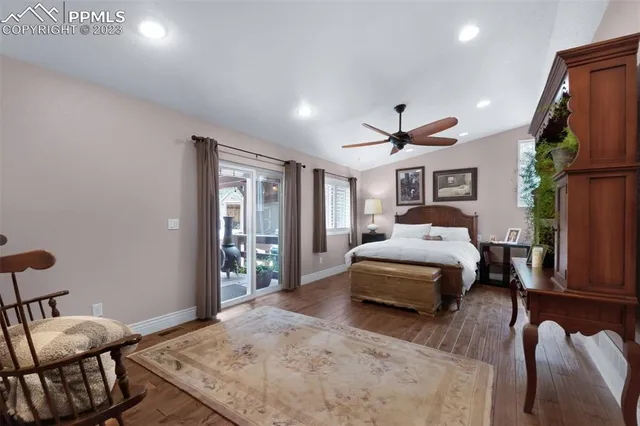 a bedroom with a bed window and couch