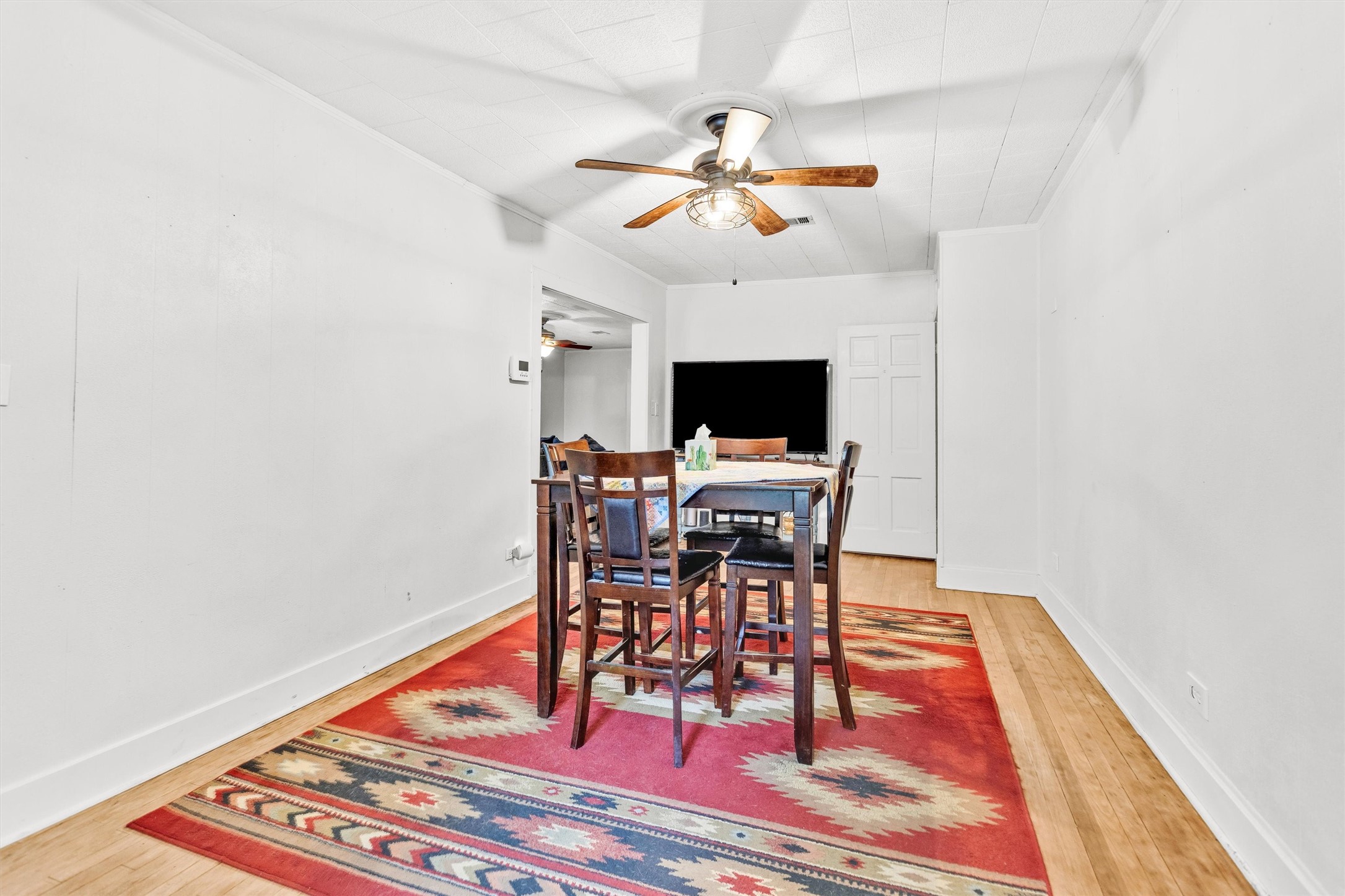 1720 18th Street Huntsville, TX 77340 - Photo 12 of 37 a view of a livingroom with furniture and a ceiling fan