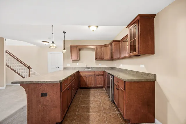 an empty room with closet and windows