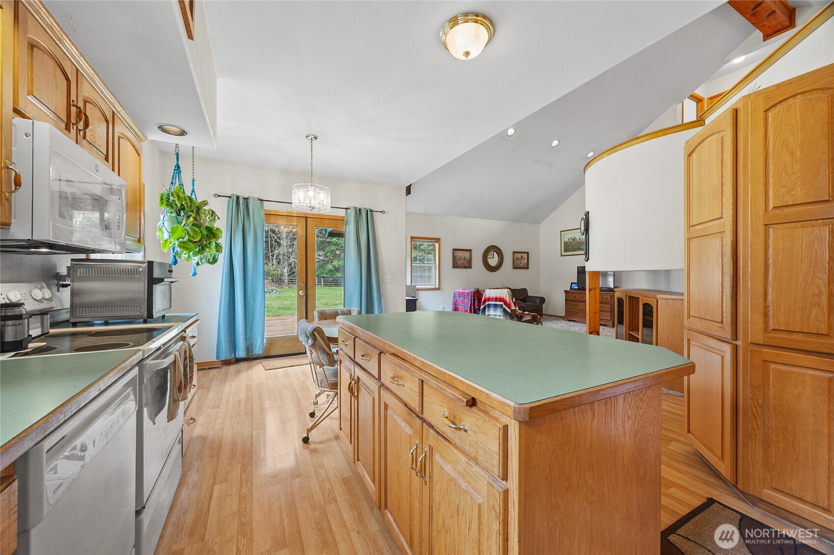 122 Ridge View Drive Randle, WA 98377 - Photo 11 of 40 a kitchen with stainless steel appliances granite countertop a stove and a refrigerator