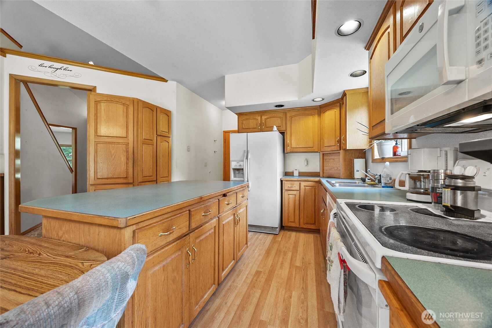 122 Ridge View Drive Randle, WA 98377 - Photo 12 of 40 a kitchen with stainless steel appliances granite countertop a sink a stove and a refrigerator