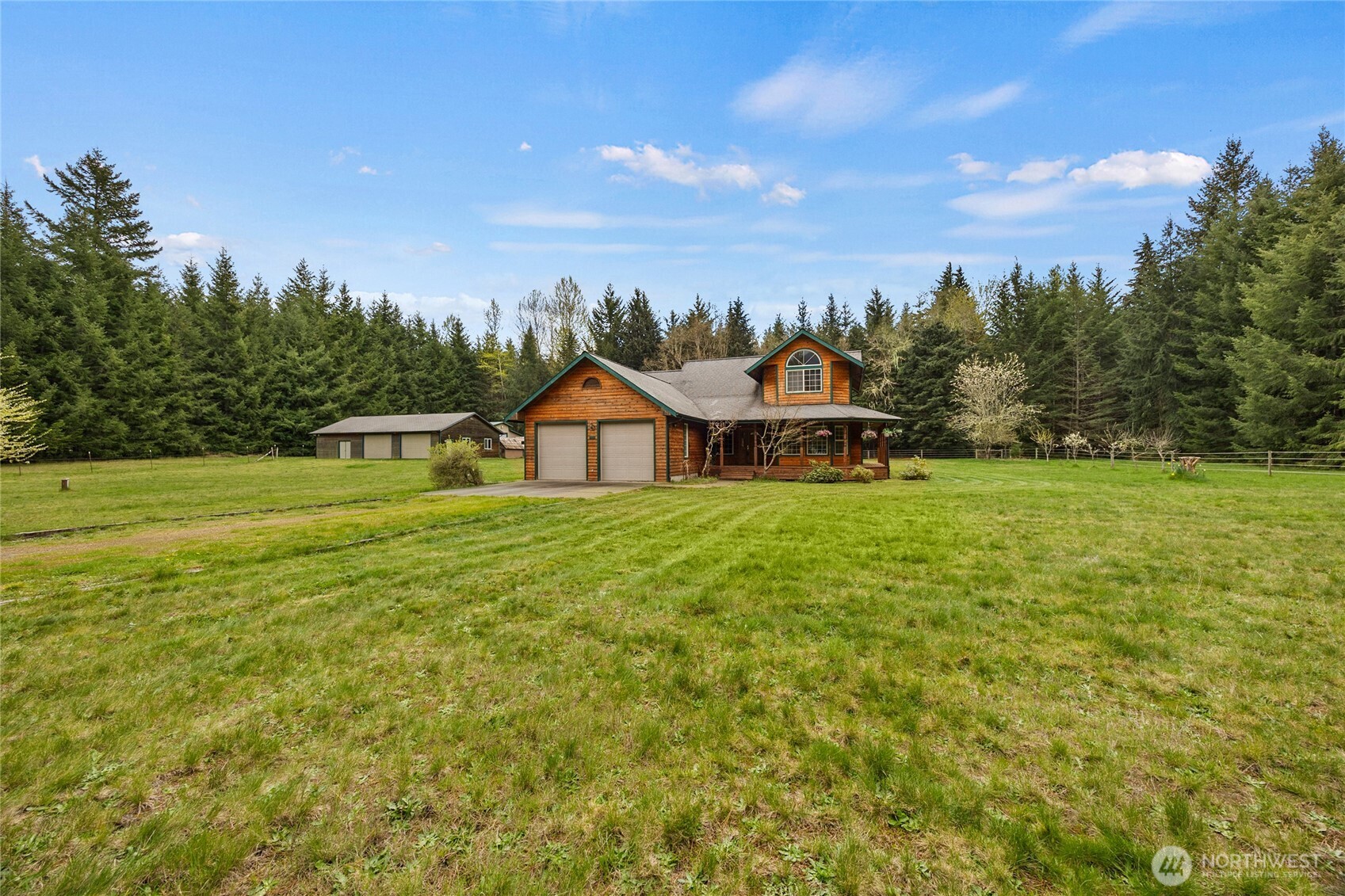 122 Ridge View Drive Randle, WA 98377 - Photo 2 of 40 a view of an house with swimming pool and trees in the background